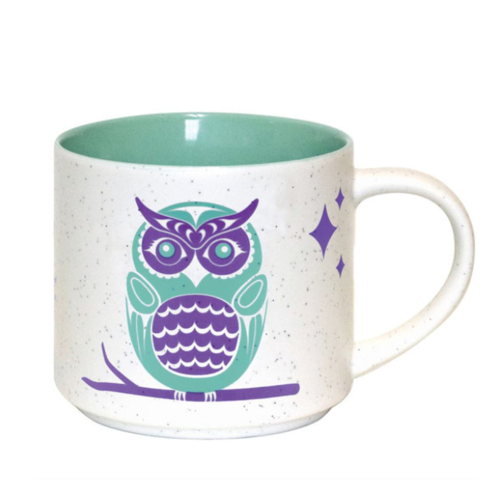 Mug with a purple owl design on a white background