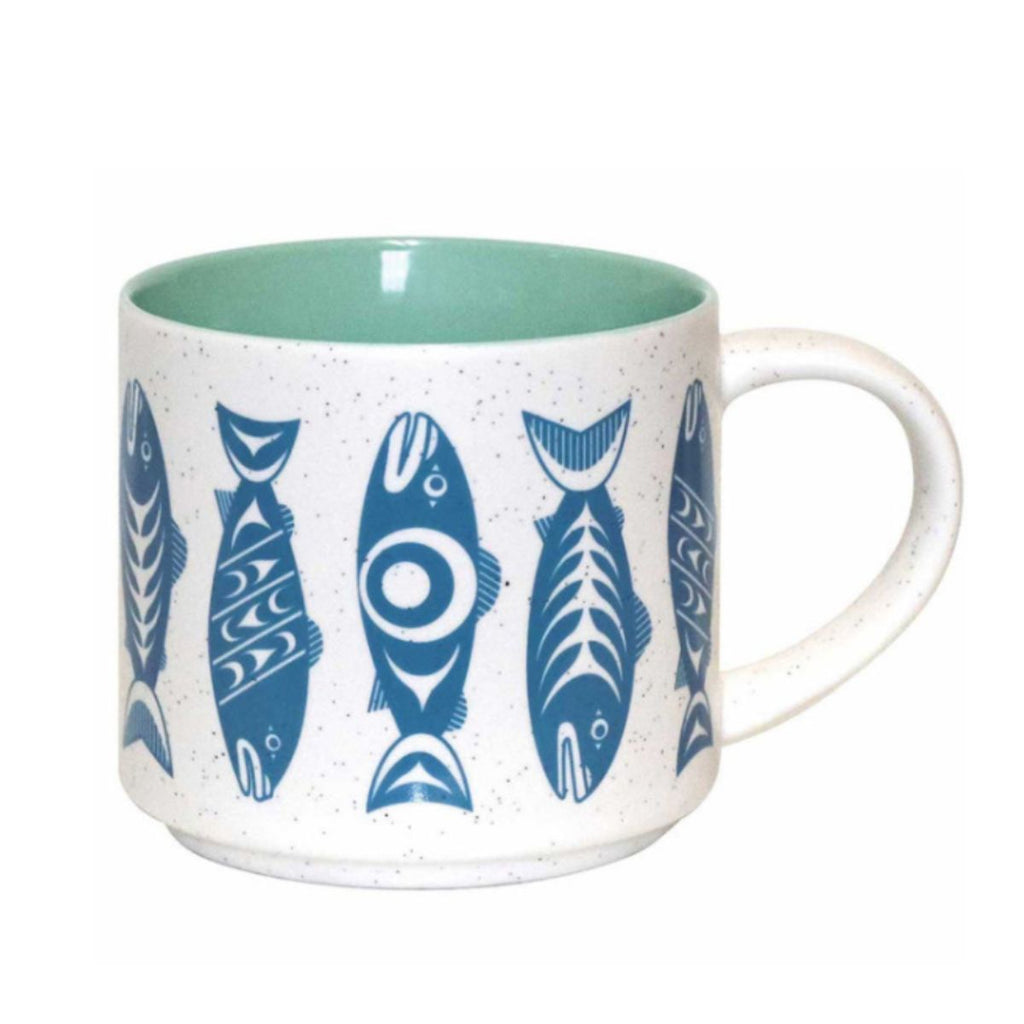 White mug with blue fish patterns on a white background
