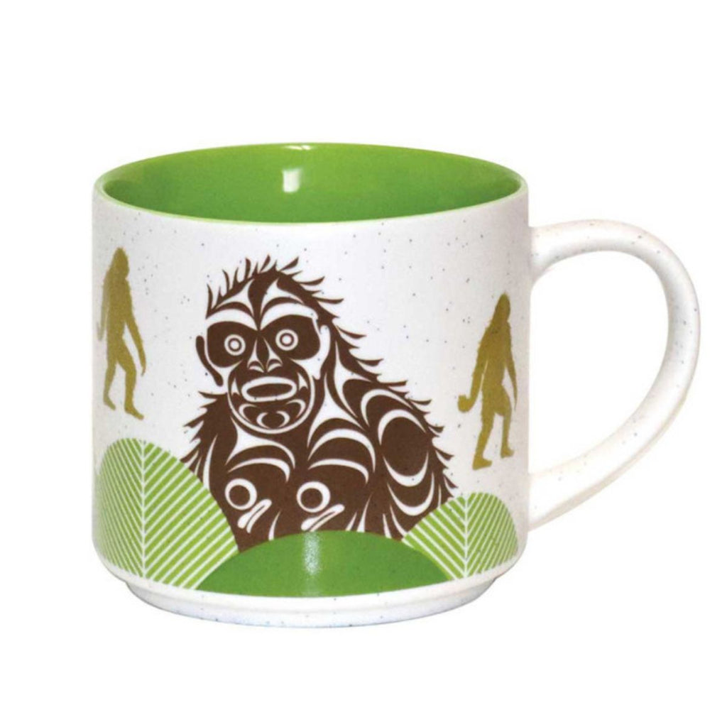 Mug with a design of a largefoot figure and green interior on a white background