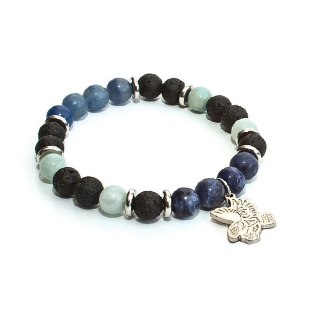 Multicolored beaded bracelet with a silver charm on a white background