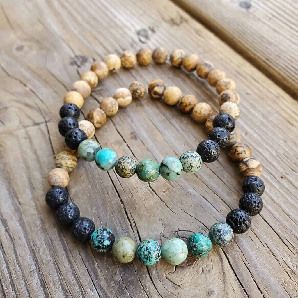 Set of beaded bracelets on a wooden surface