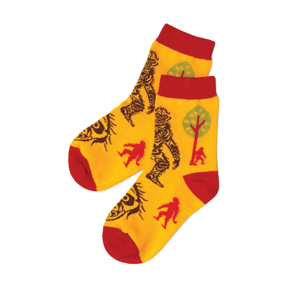 Yellow socks with red accents and animal prints on a white background