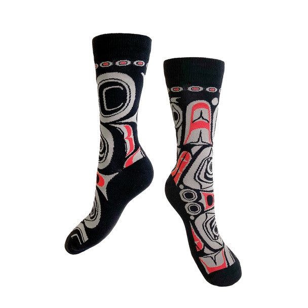 Pair of socks with black, gray, and red patterns on a white background