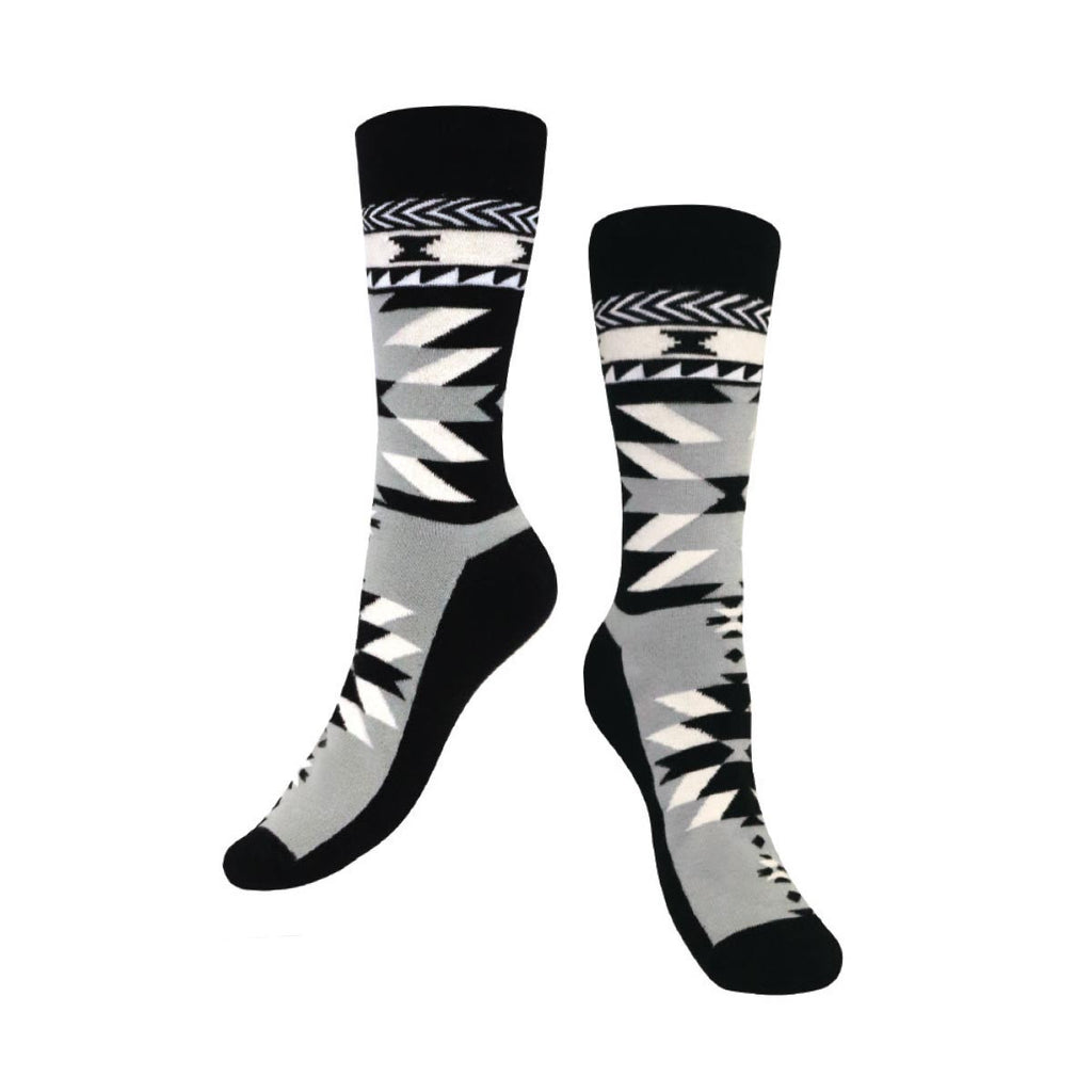 Pair of black, gray, and white patterned socks on a white background