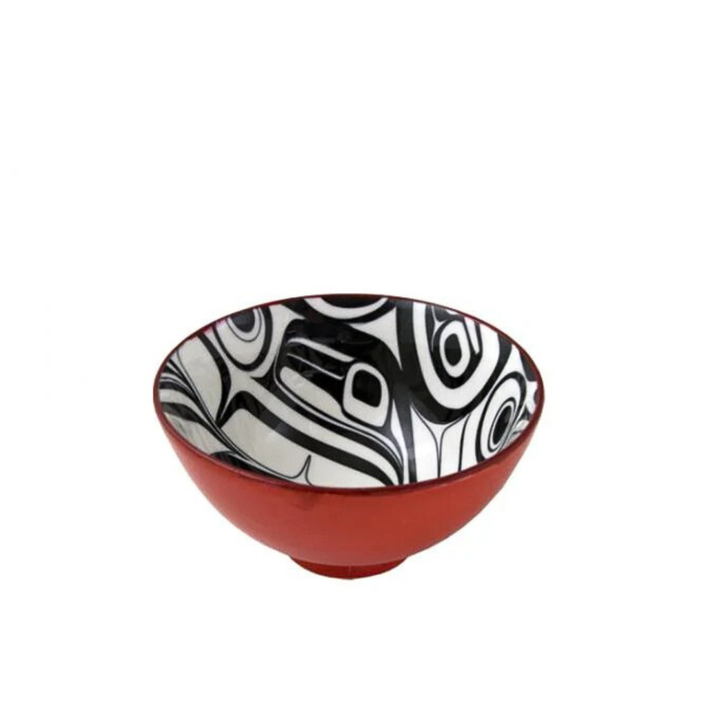 Ceramic bowl with black and white abstract pattern on a red base