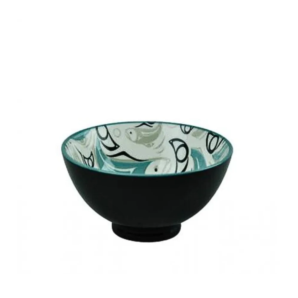 Ceramic bowl with black exterior and patterned interior on a white background